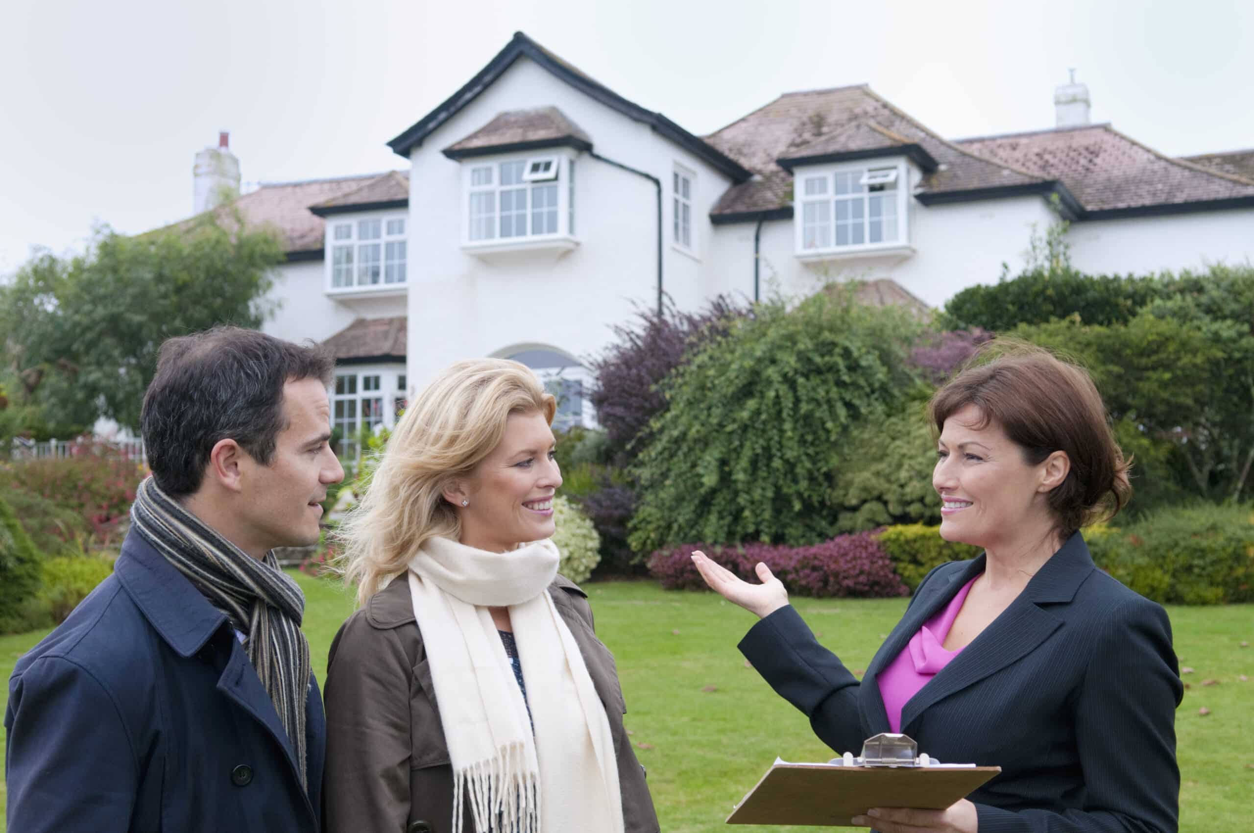 Real estate agent showing a home to clients